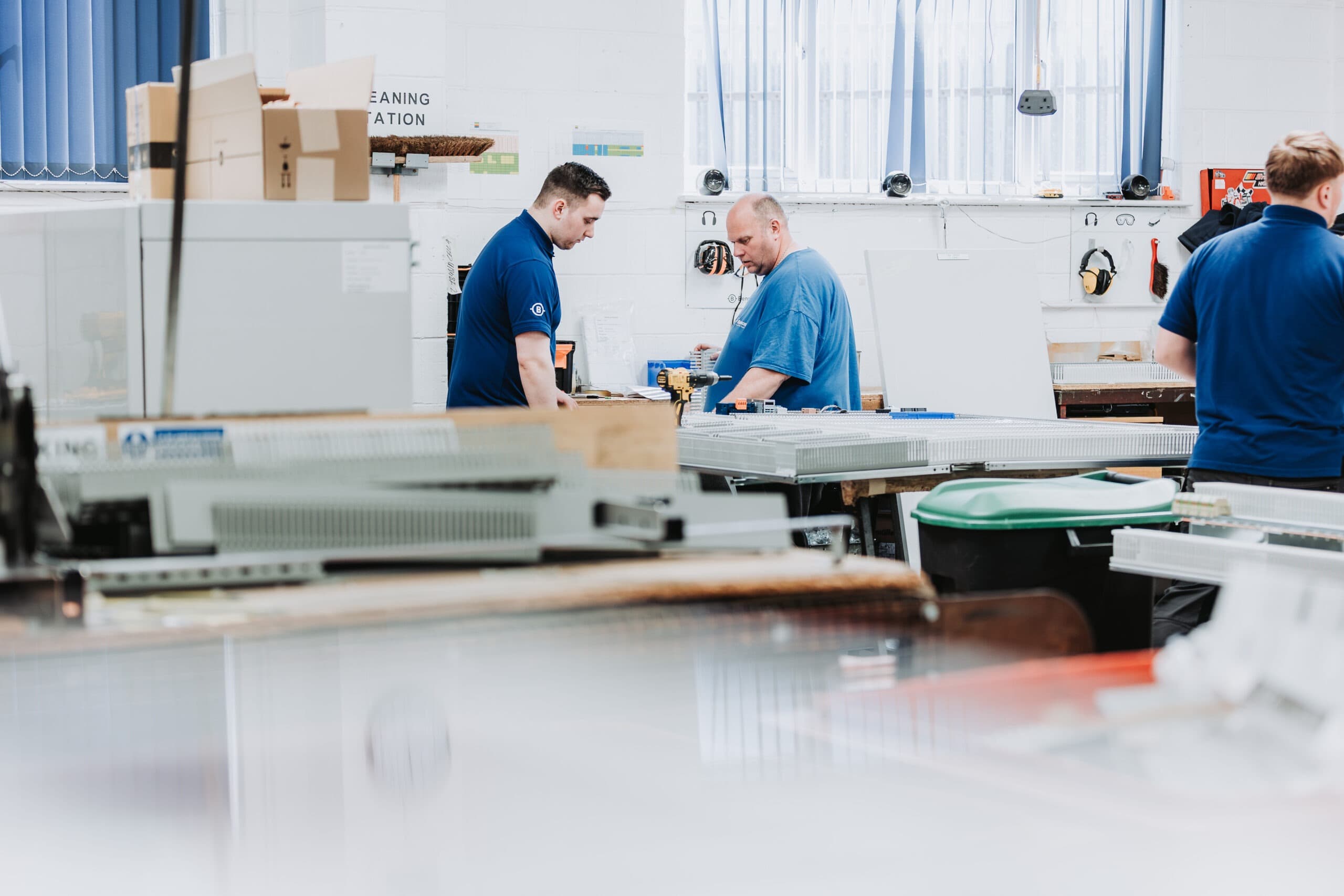 Operations leader walking the production line with a tablet